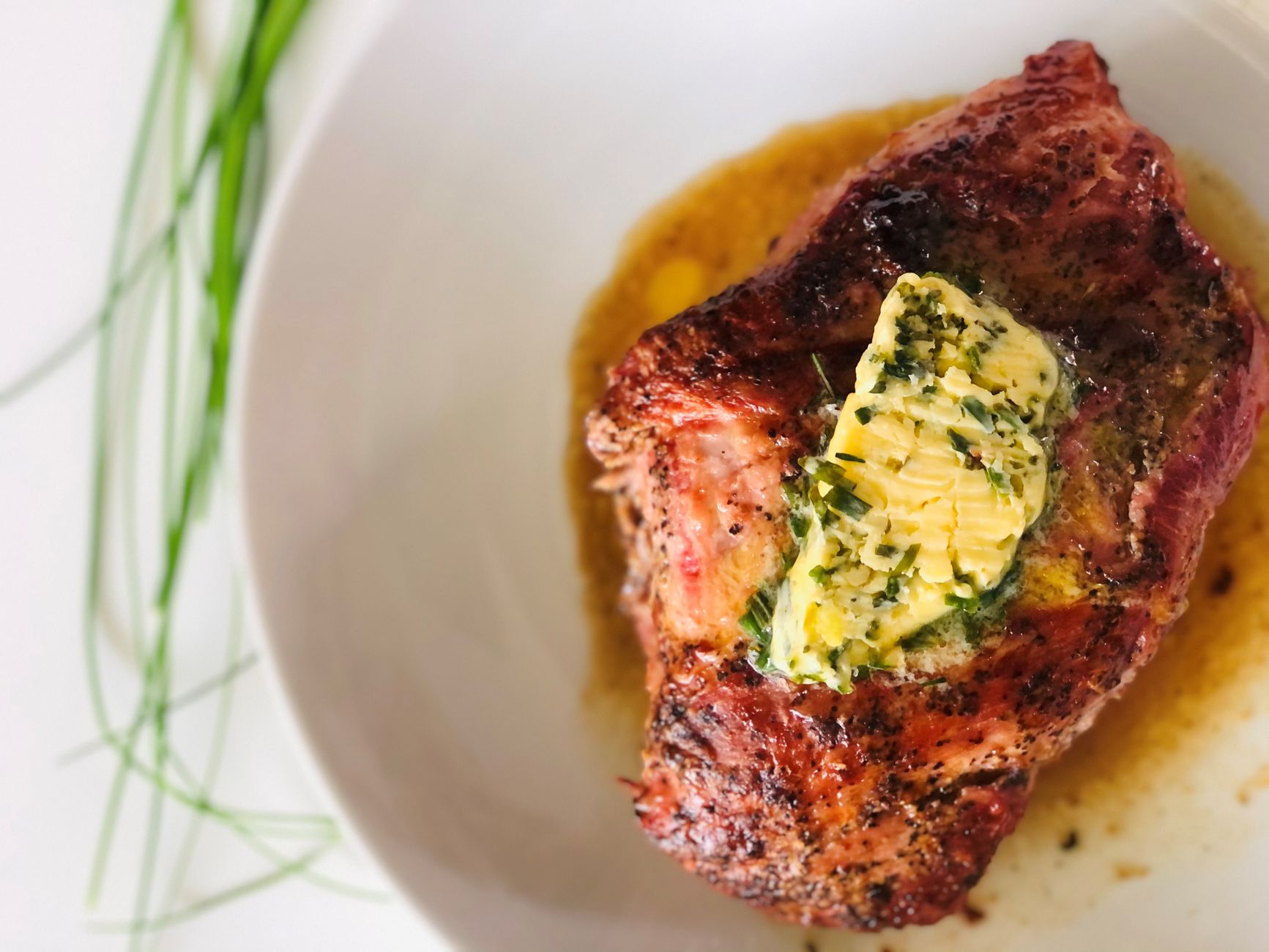 Juicy air fryer steak topped with garlic herb butter