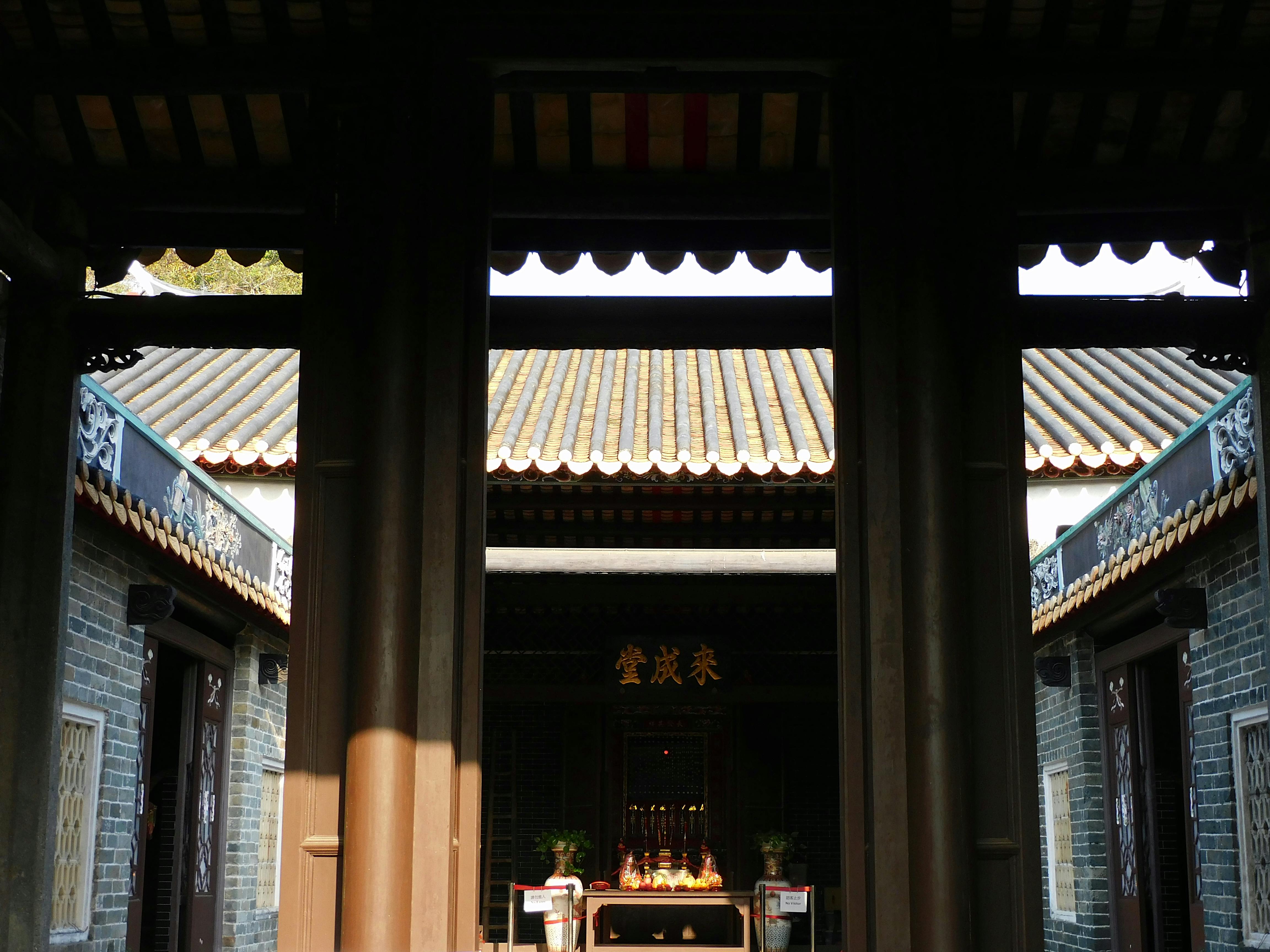 yard of buddhist temple on sunny day