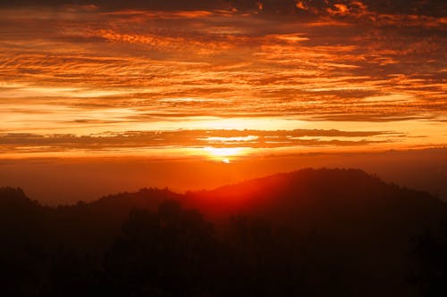 Бесплатное стоковое фото с апельсин, вид на горы, восход