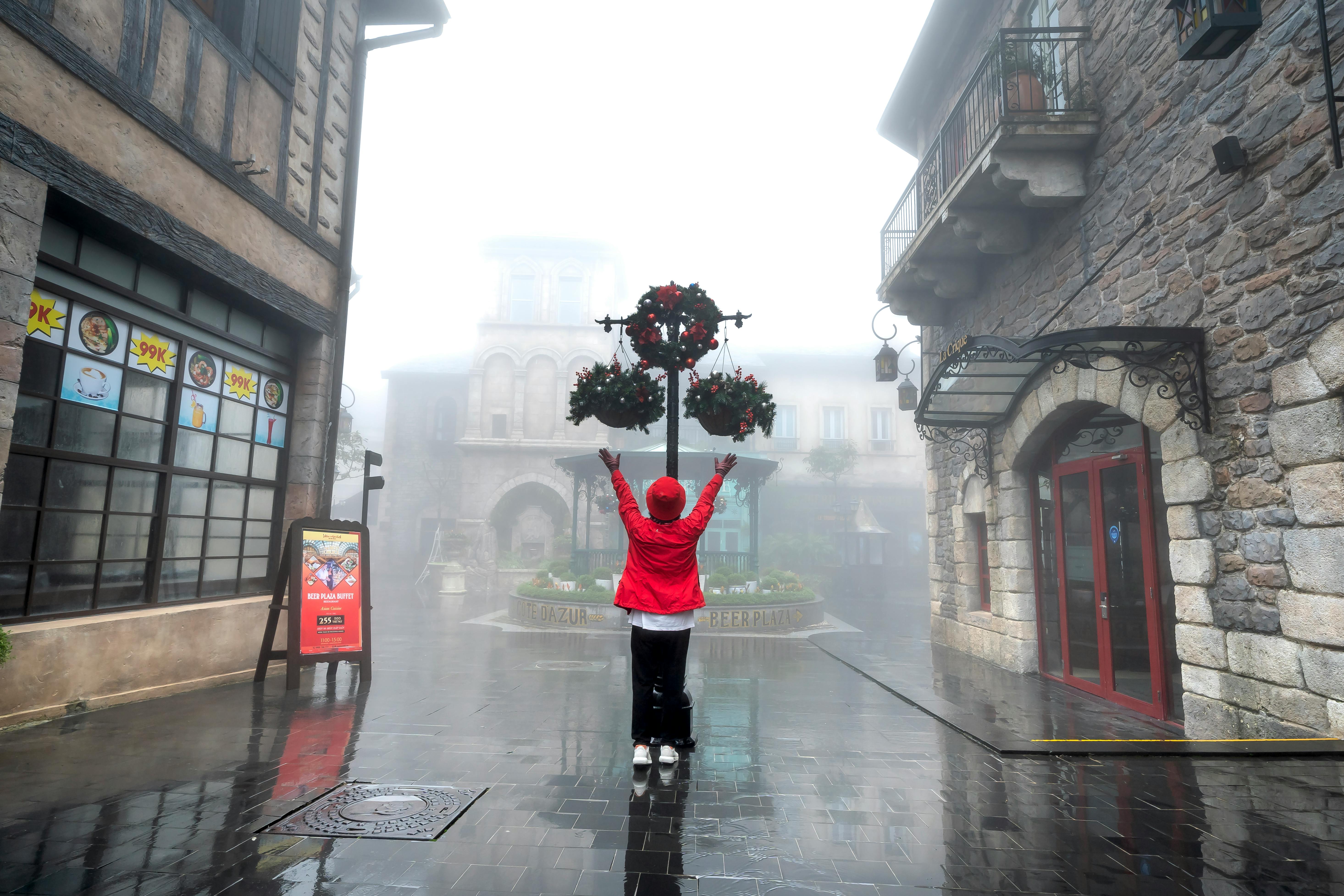 A Person in Red Jacket Standing on the Street · Free Stock Photo