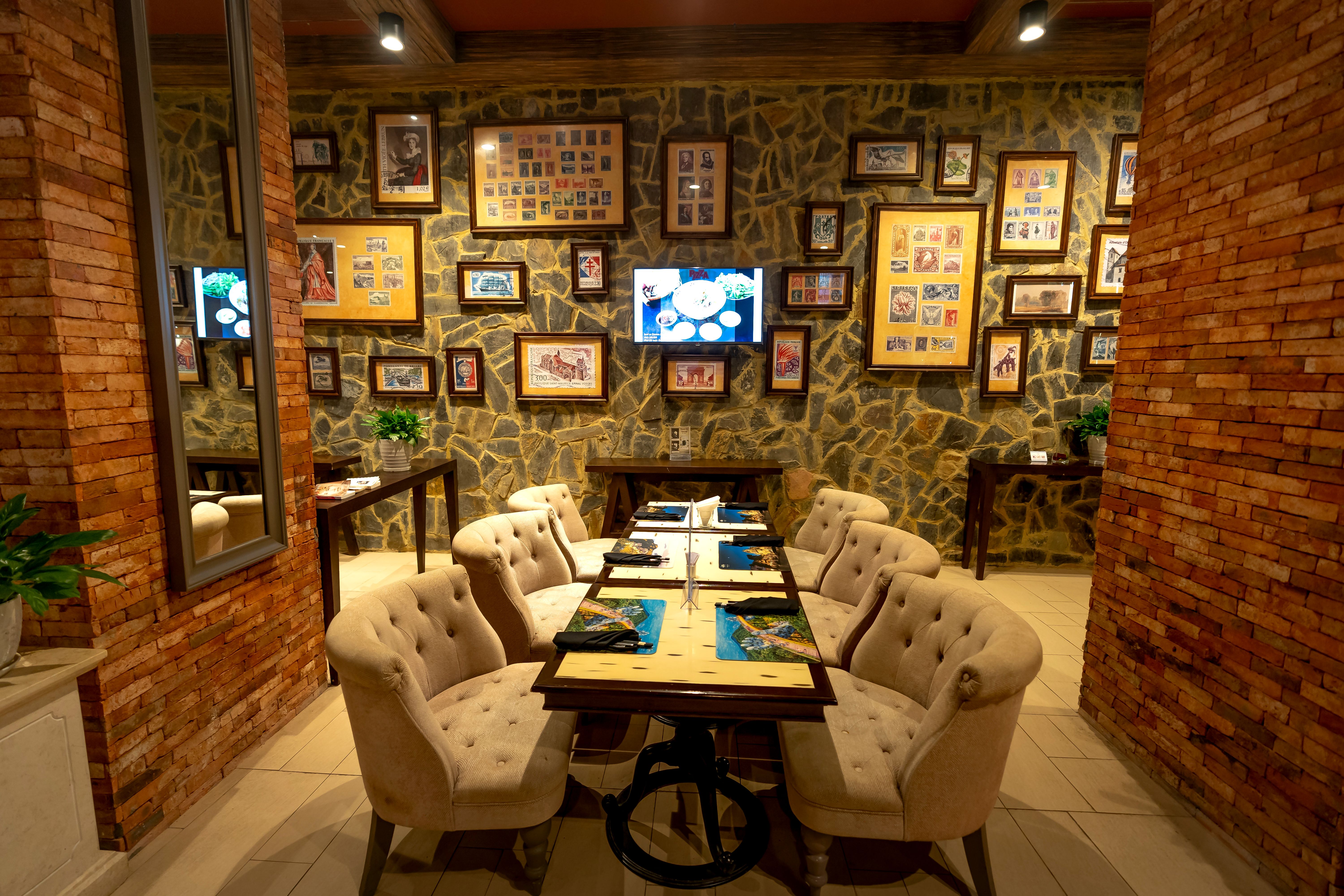 Luxurious restaurant setting featuring plush armchairs and elegant decor, perfect for dining.