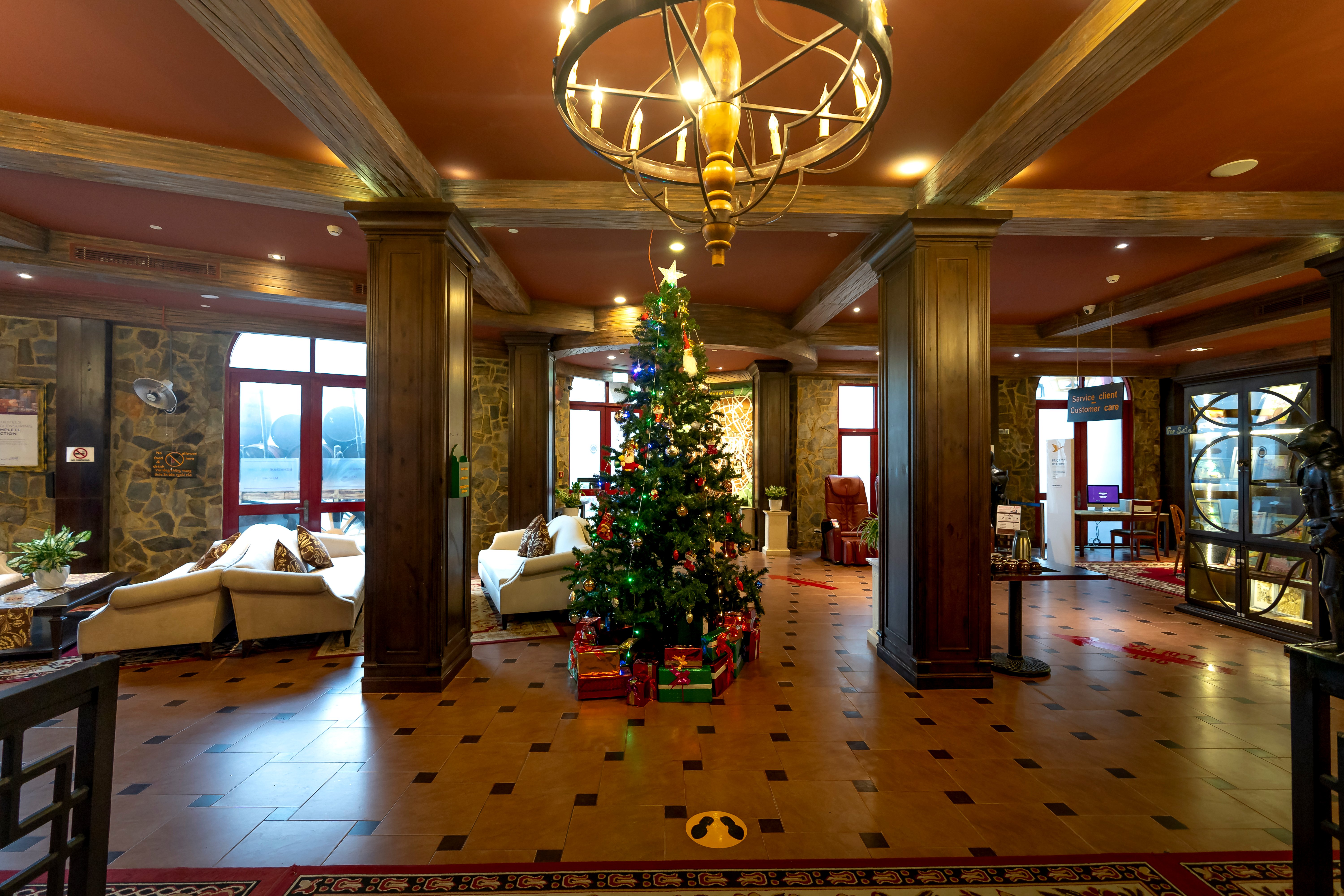 Festive hotel lobby with Christmas decorations - Holiday promotions DC social