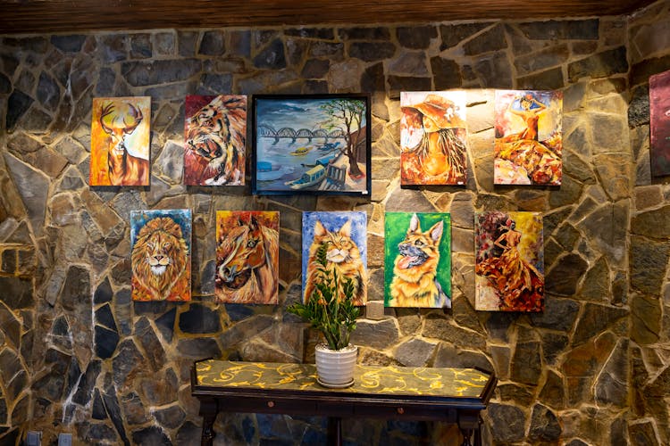 Animal Portraits Hanging On Wall Made With Rocks