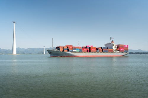 Cargo Ship on Sea Under the Blue Sky