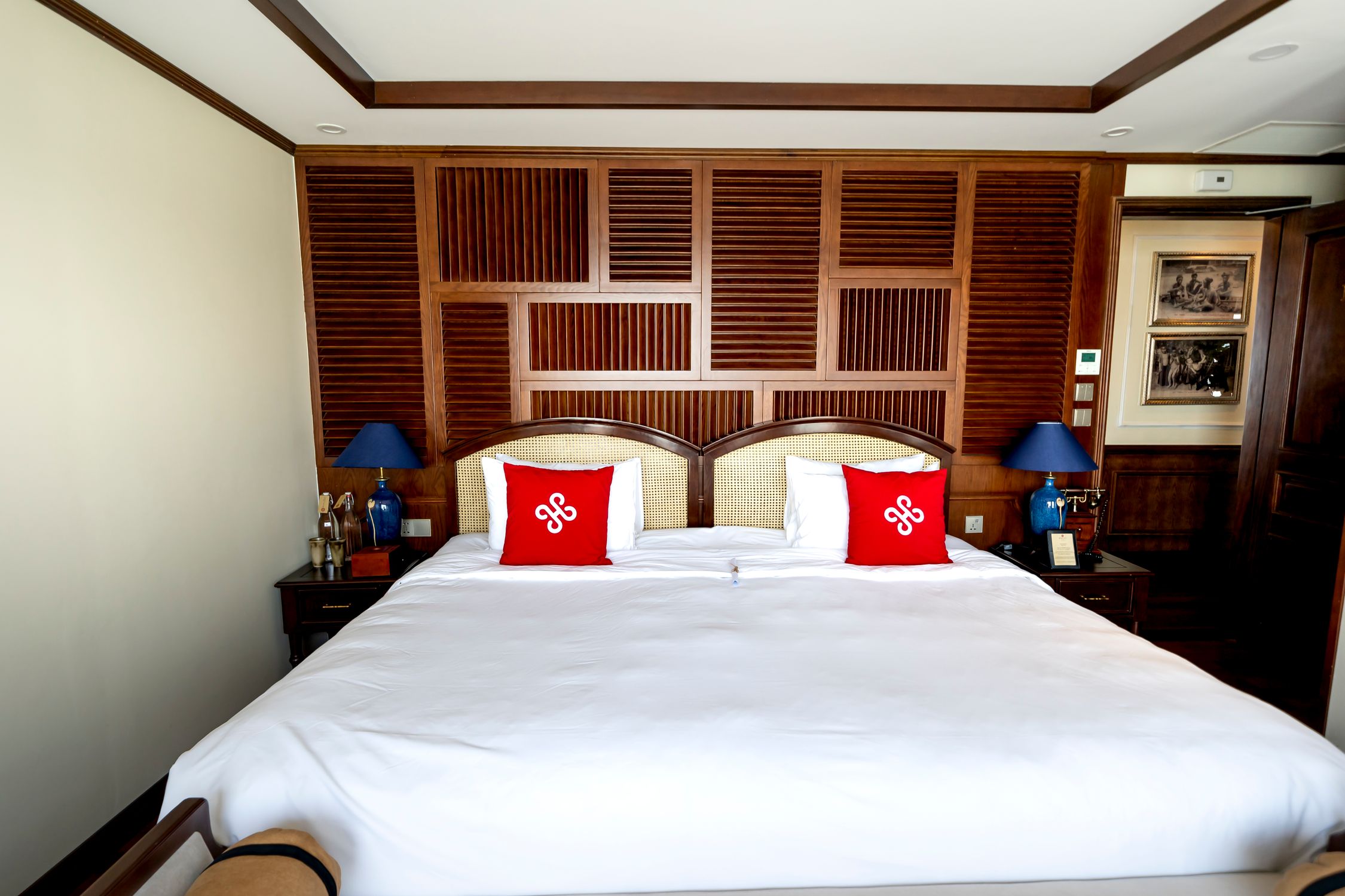 Elegant bedroom with stylish wood accents and a comfortable king-sized bed.