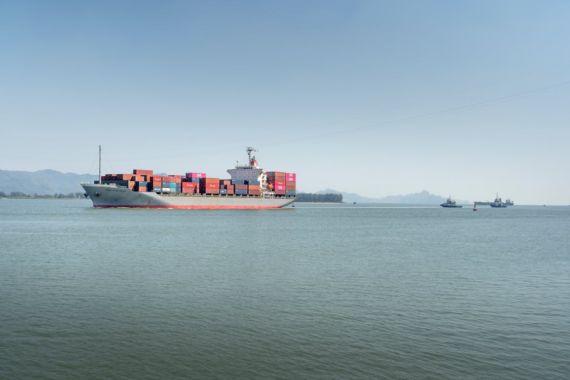 Cargo Ship Sailing in Sea 