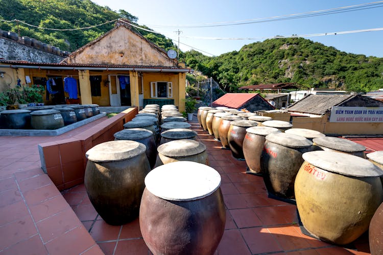 Big Jugs Near House In Traditional Village