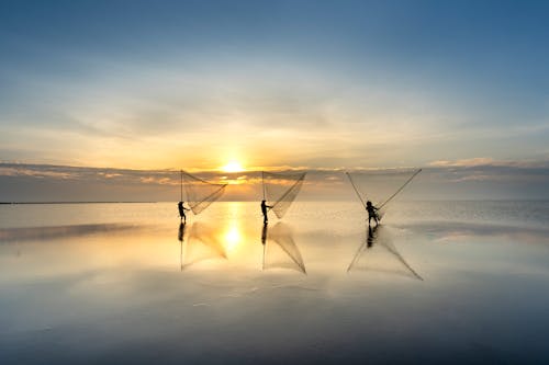 Fishermen with Nets in Sea