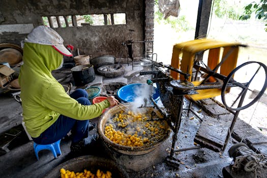 A woman processes silk in a traditional Vietnamese silk village workshop.