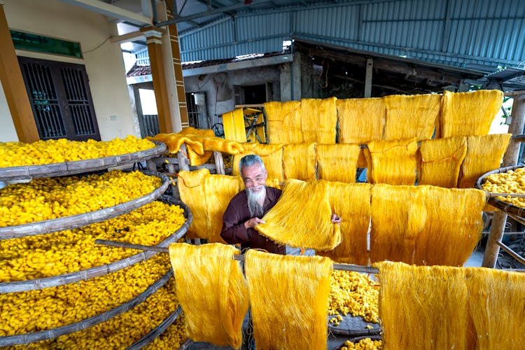 Man Holding Yellow Fibers