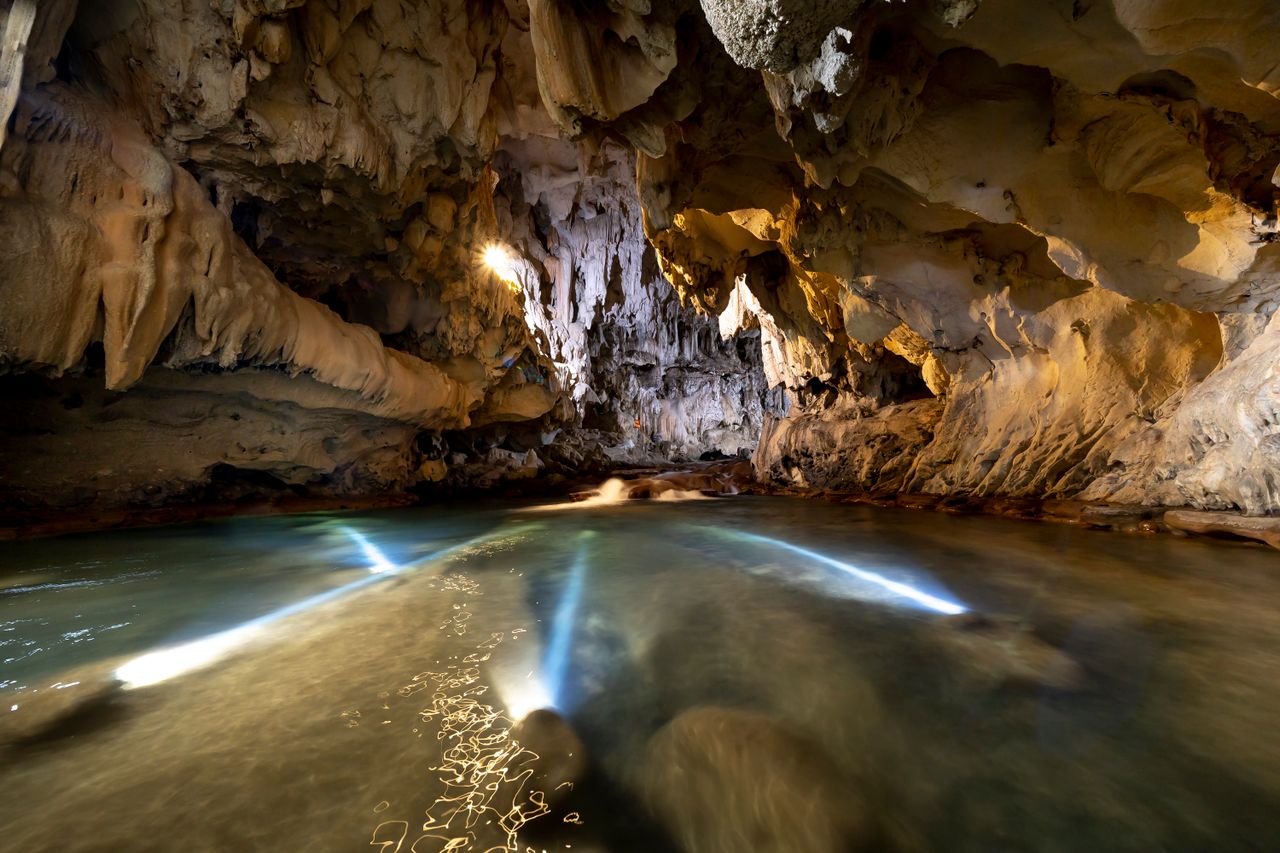 explore the mystical limestone cave with stunning stalactites and sere