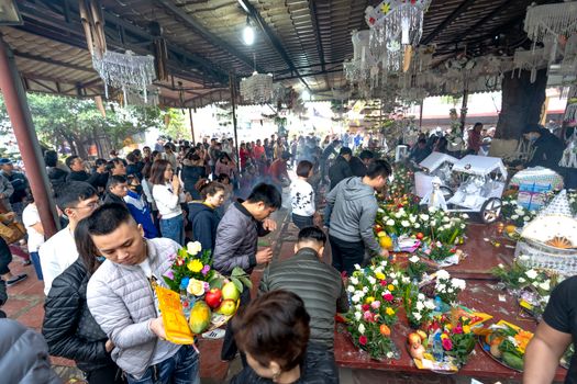 A bustling market scene with colorful flowers and fruit offerings, capturing cultural traditions.