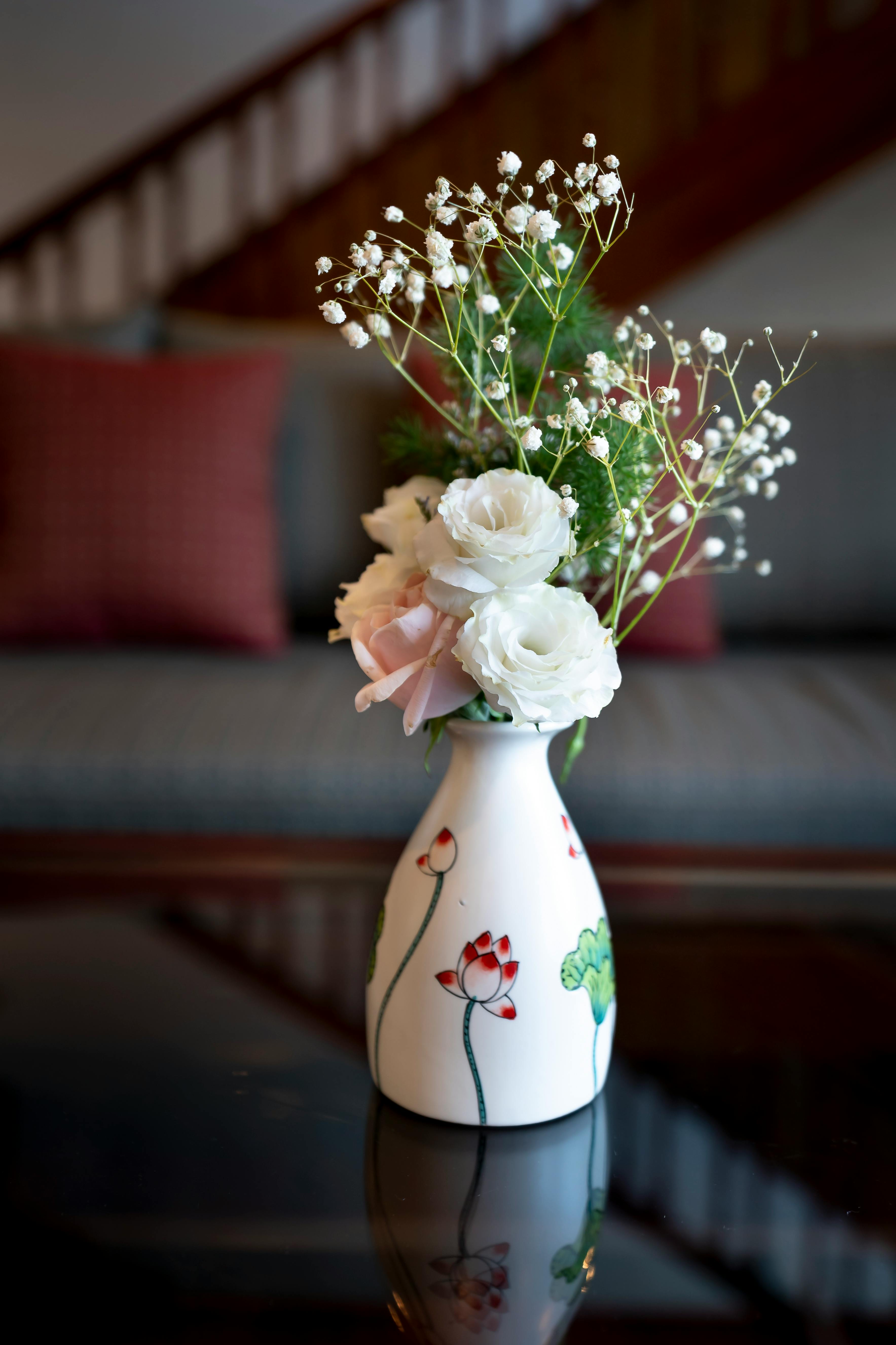 Closeup of Flower Bouquet in a Vase on a Coffee Table · Free Stock Photo