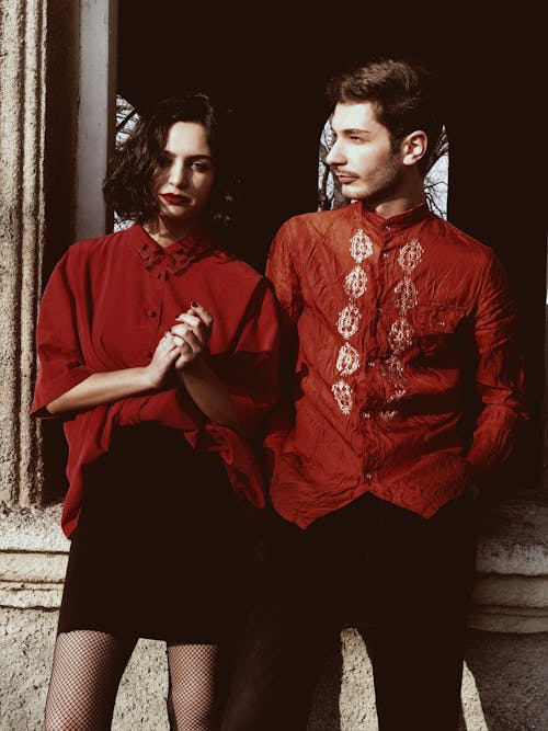 Photo of a Couple Wearing Red Tops