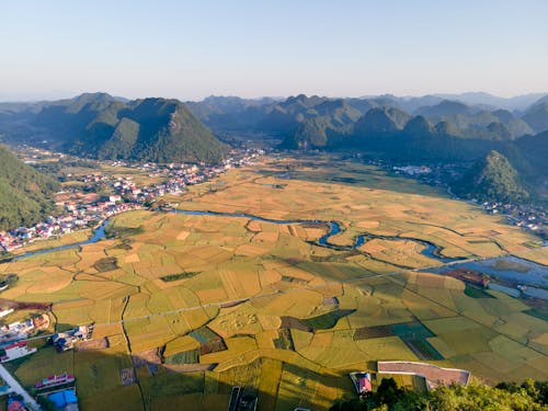 Aerial View of Croplands Between Mountains 
