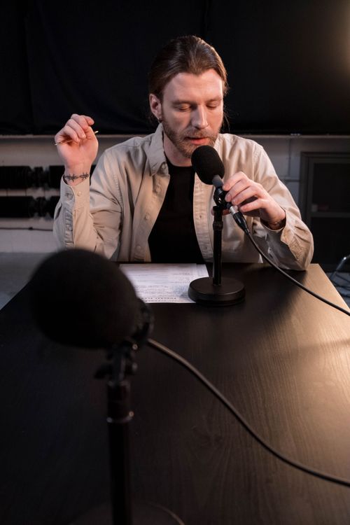 Former NFL player at podcast microphone