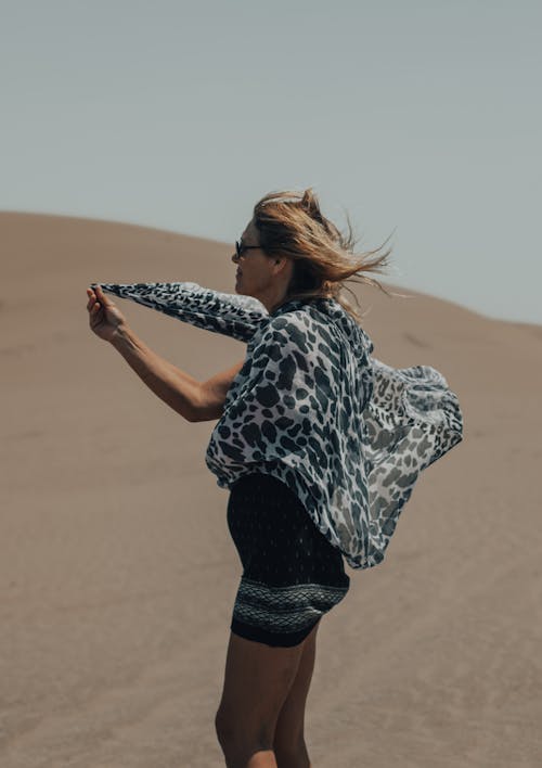 A Woman Standing on the Desert