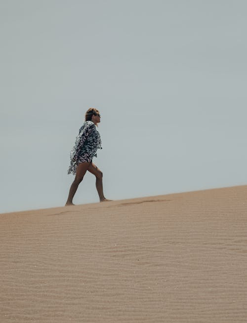 A Woman Walking on the Desert