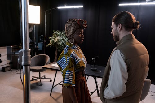 Man Standing with Model at Studio