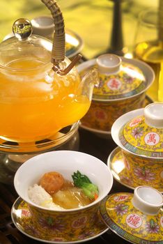 Traditional Chinese tea set with dim sum bowls beautifully arranged, showcasing cultural elegance.