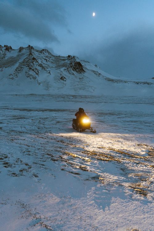 Person Riding a Snowmobile · Free Stock Photo