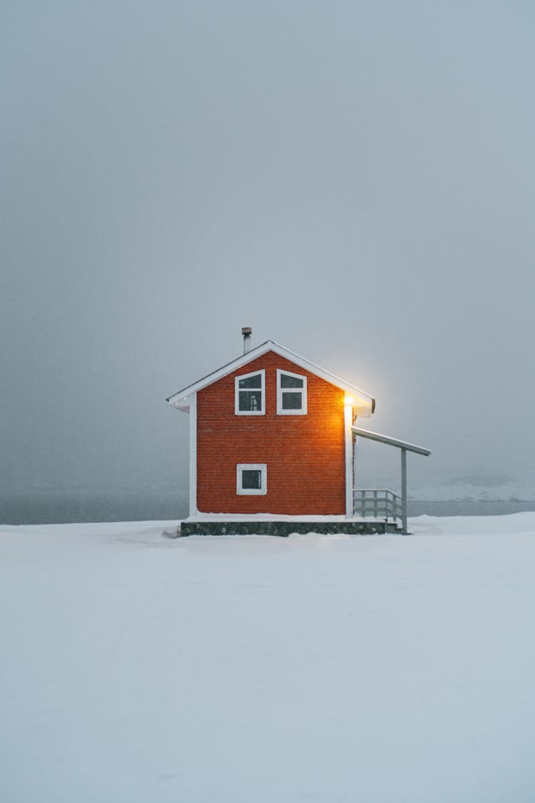 A House In The Middle Of White Snow