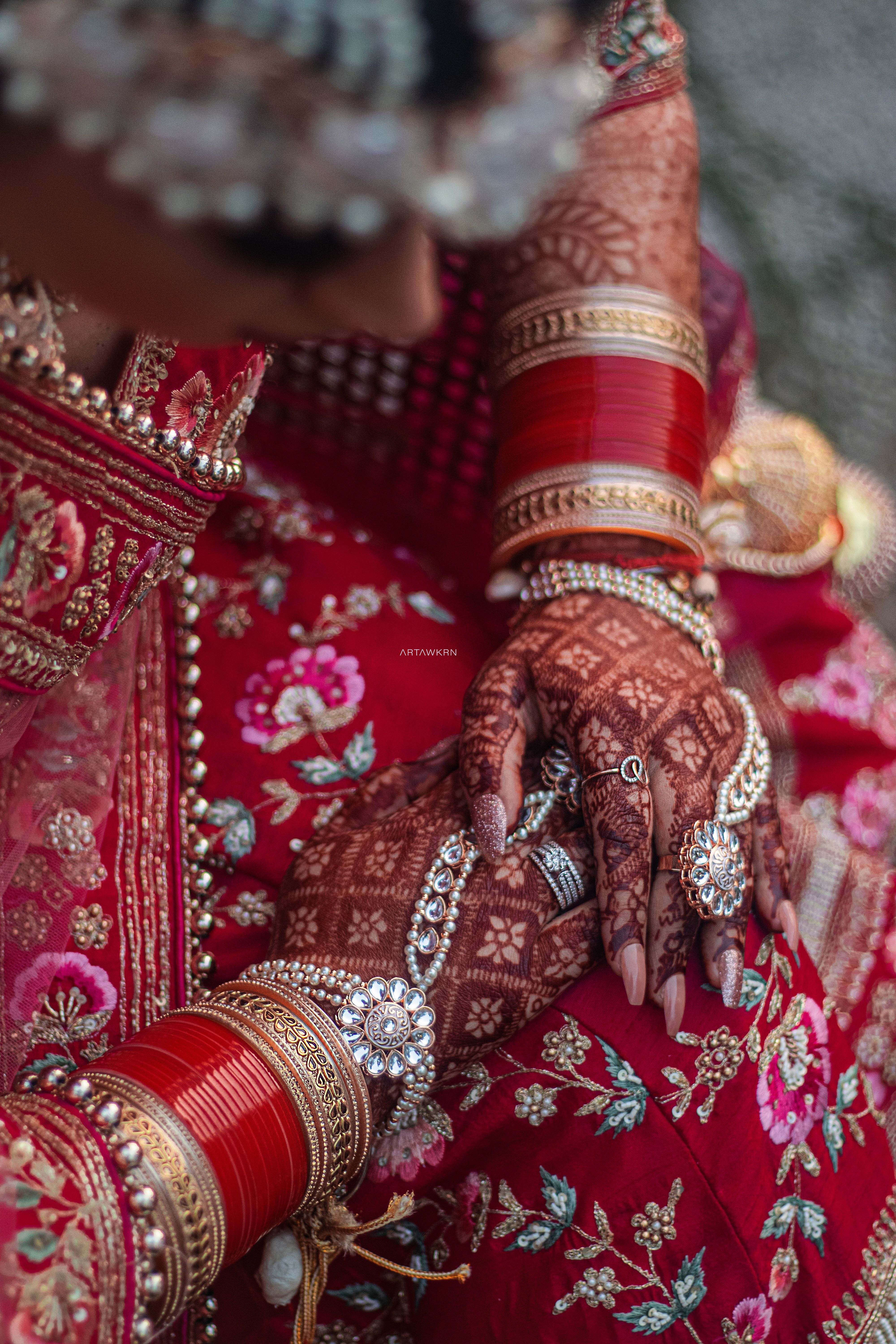 Pakistani bride and groom in traditional wedding attire