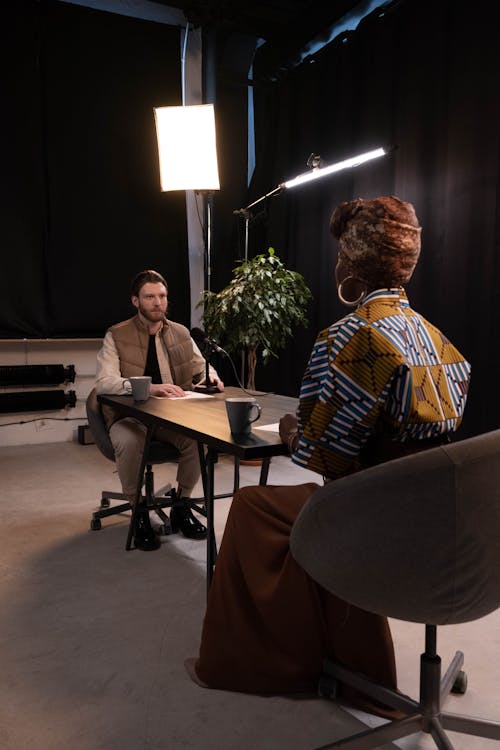 A man interviewing a woman