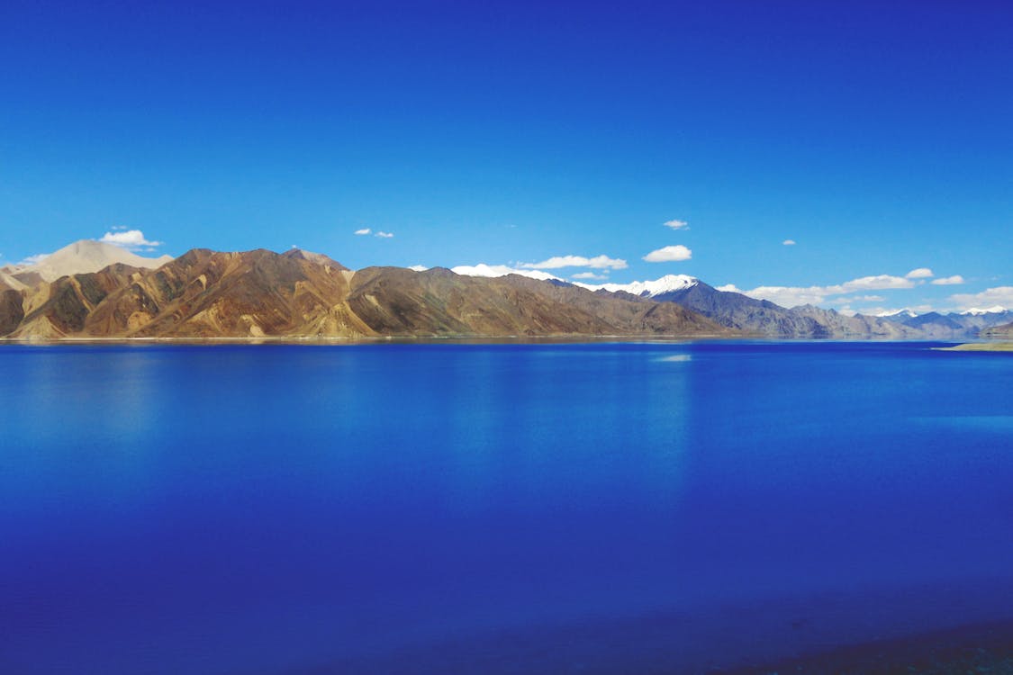 Body of Water Near Mountain Hills