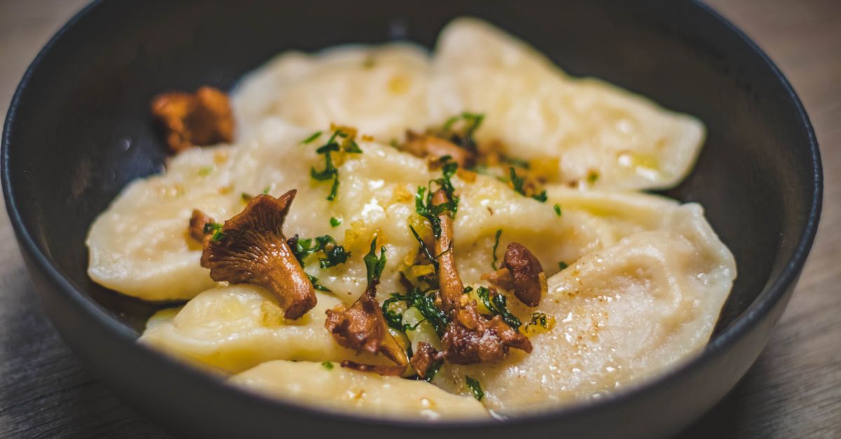 feta pasta with sautéed mushrooms and balsamic glaze, served in a rustic bowl