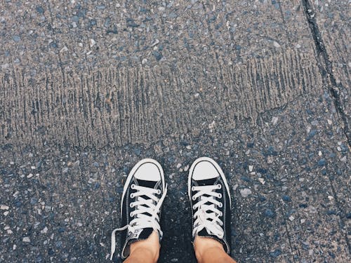 Free Person Wearing Pair of Black-and-white Converse All Star Low Sneakers Stock Photo