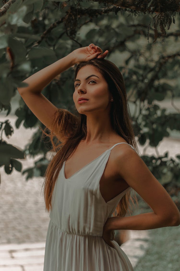 Slender Woman In Summer Cotton Dress Near Green Tree