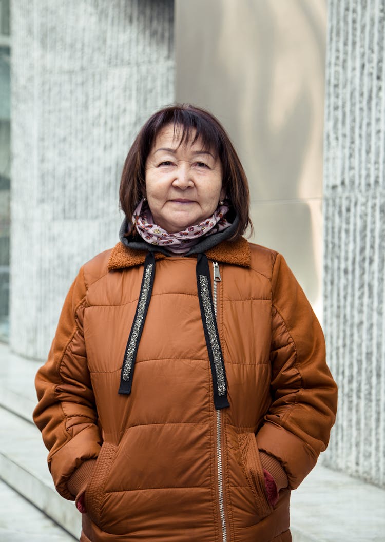 Cheerful Senior Asian Woman In Jacket Smiling