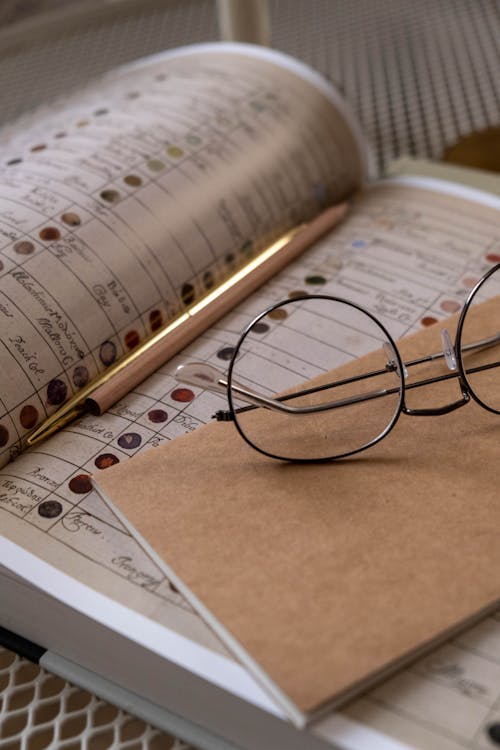 Free Close Up Shot of a Eyeglasses on the Book Stock Photo