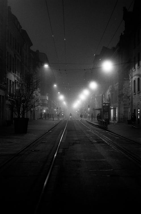 Black and White Photograph of a Dark Street at Night · Free Stock Photo