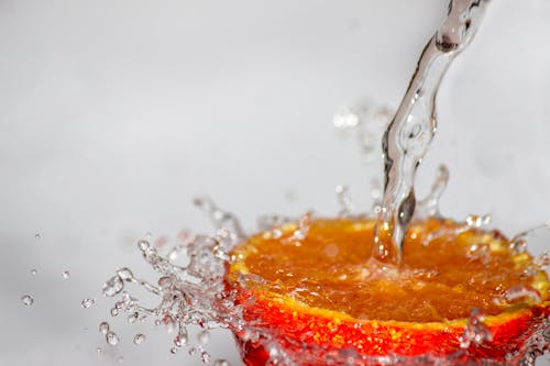 Free Red Fruit Spilled With Water Time Laps Photo Stock Photo