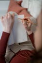 Close-Up Shot of a Person Writing on a Notebook