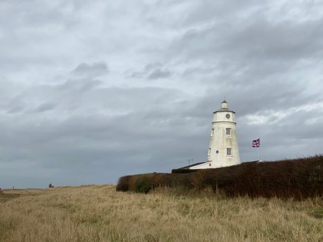 White Lighthouse Under the Cloudy Sky