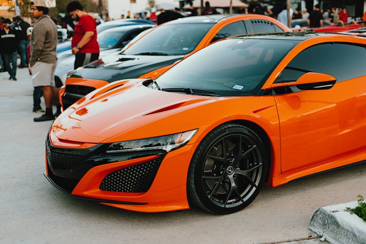 Orange Car Parked On The Parking Lot