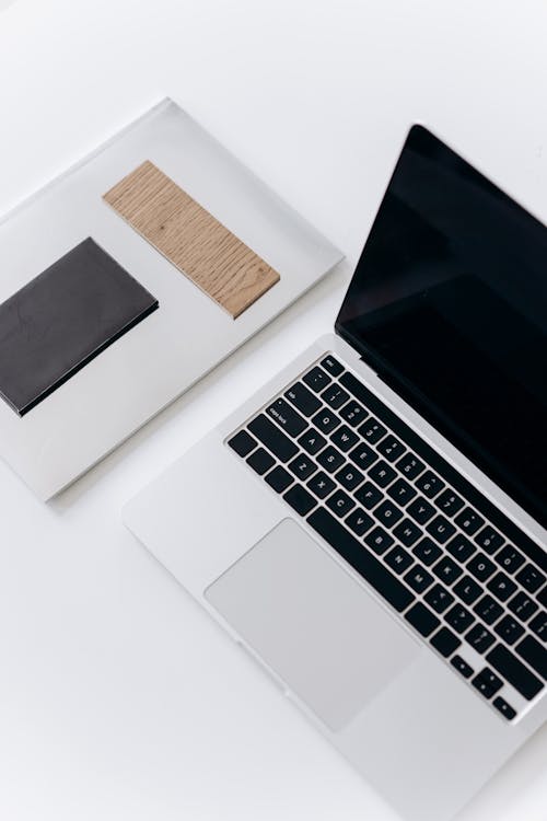 Free Silver and Black Laptop on the Table Stock Photo