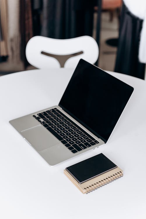 Free Silver and Black Laptop on the Table Stock Photo
