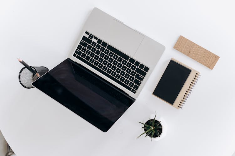 Macbook Laptop On White Surface 