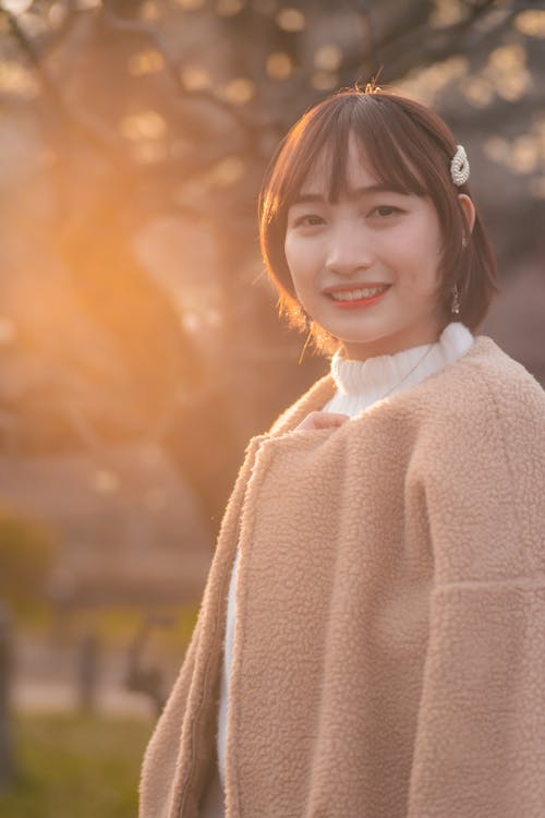 A Woman in Brown Sweater Smiling