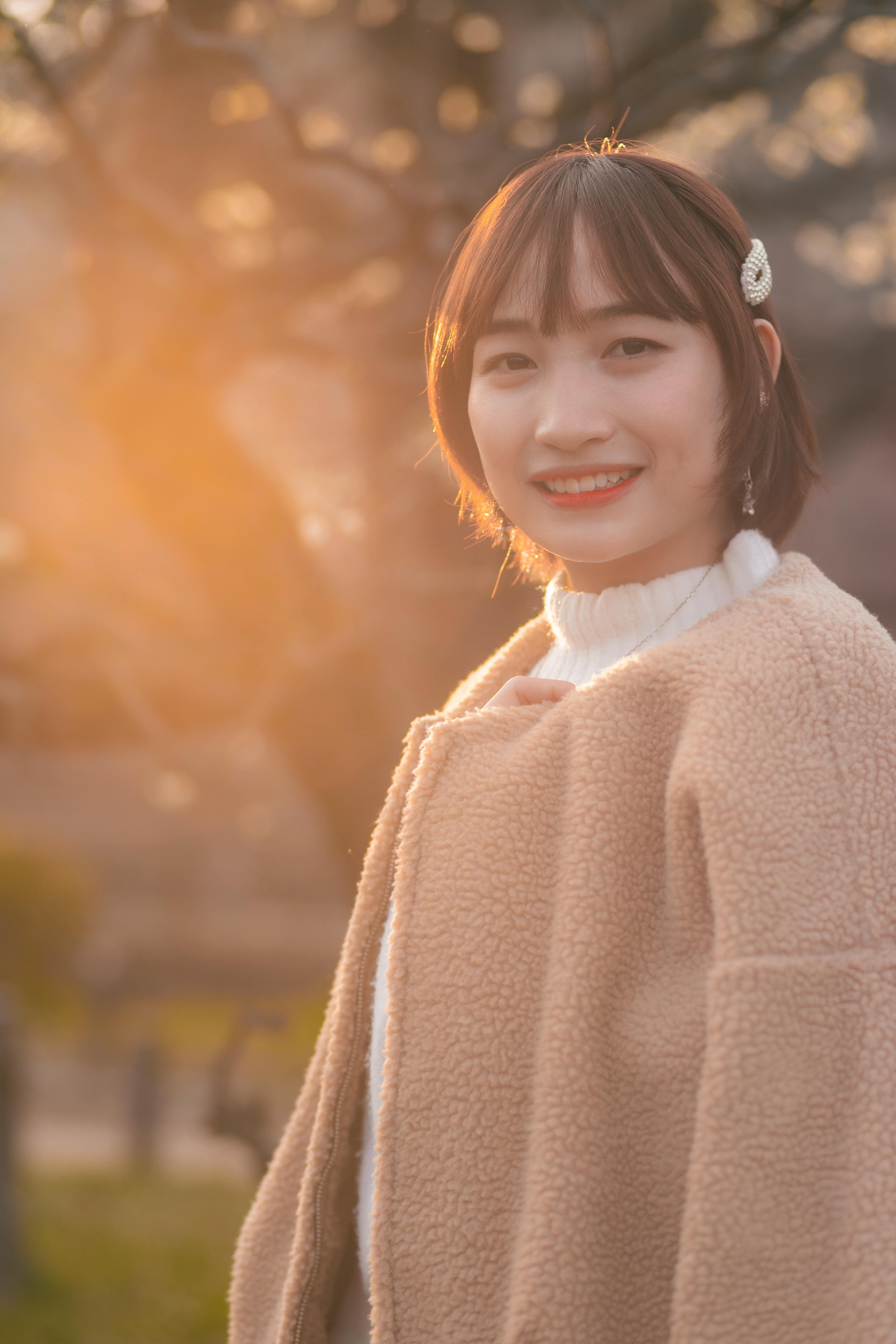 A Woman Holding Red Balloons · Free Stock Photo