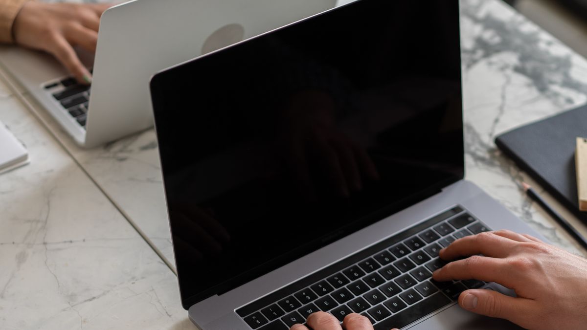 Woman working on a laptop at a desk
