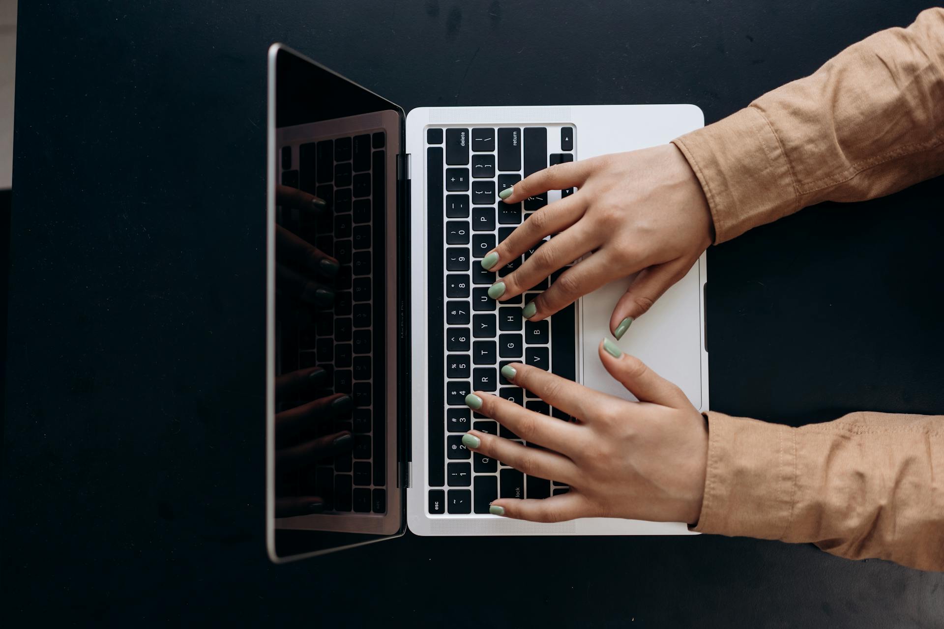 Close-Up Shot of a Person Using a Laptop