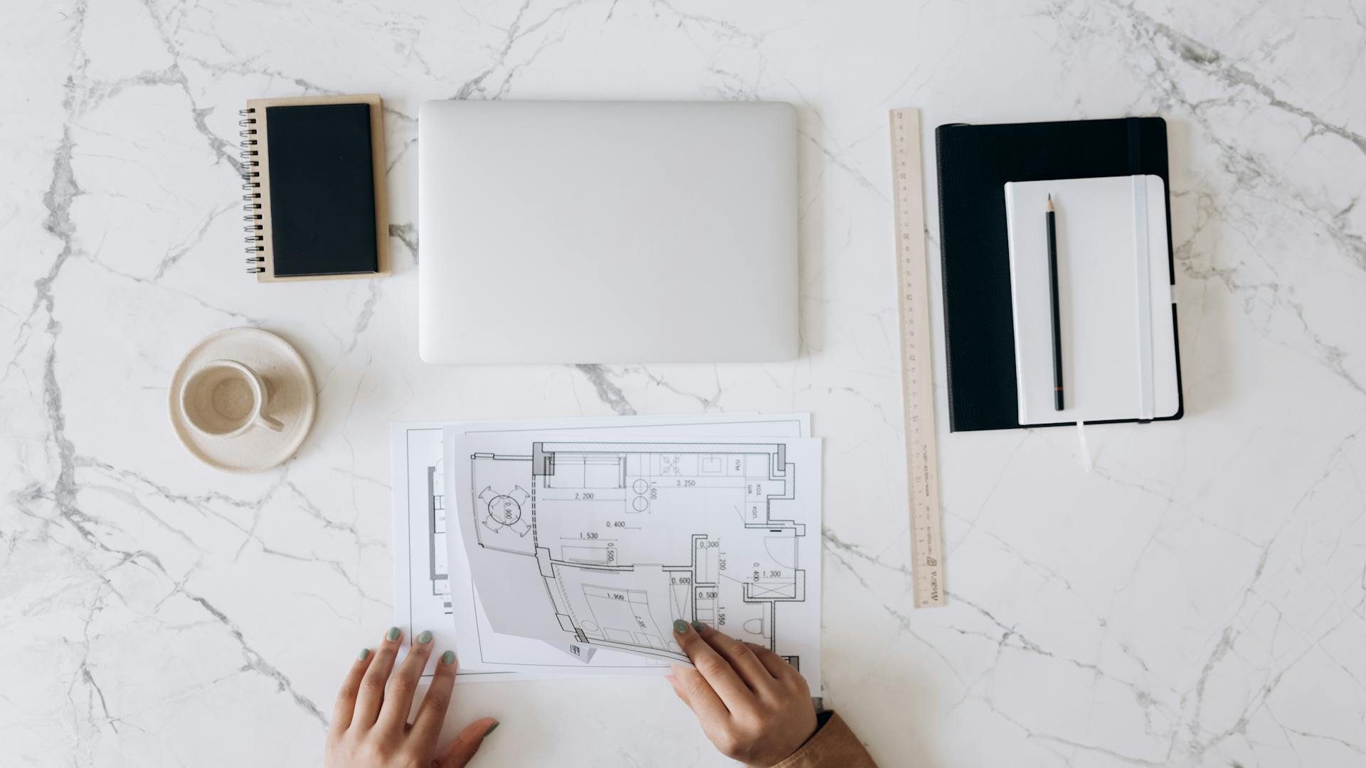 An Architect's Work Table With Tools and Blueprints
