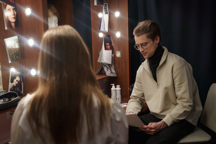 Man Reading A Script In The Dressing Room