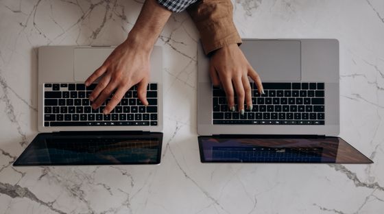 Two people working together on a laptop — photo by Mikhail Nilov on Pexels