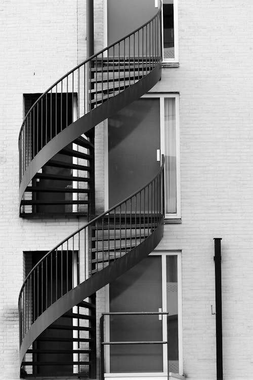 
A Grayscale of the Fire Escape of a Building
